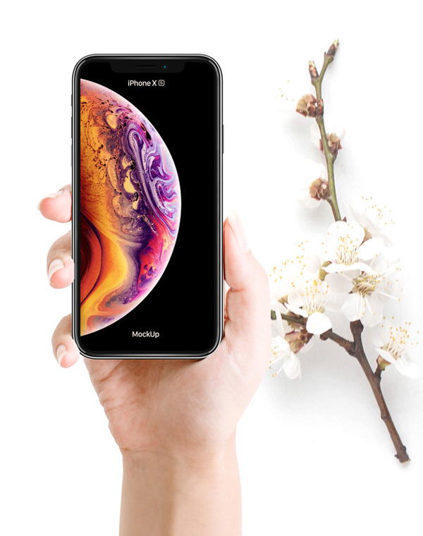 Free Woman Holding iPhone XS Mockup PSD